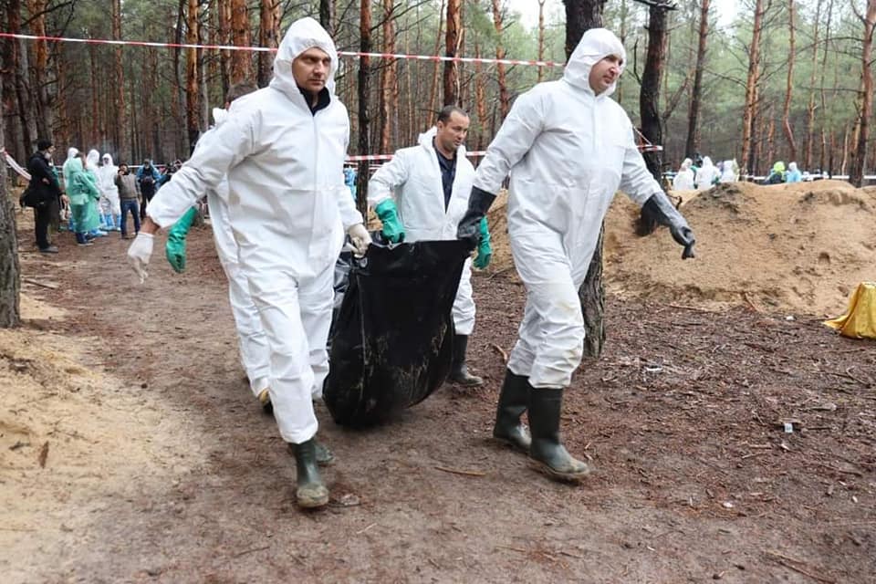Burial site in the forest near Izium after exhumations began in September 2022; no victims are visible